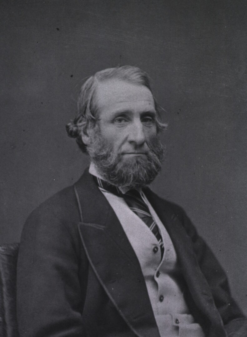 A portrait photograph of Sir John Tomes.